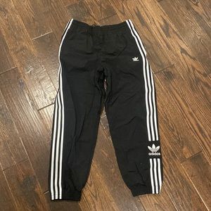 Womens Adidas track pants.  US Medium.  Never worn.